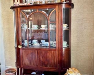 Antique (c 1910) china cabinet w/ two enclosed shelves, two open shelves, and cupboard.