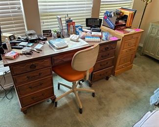 Office desk and supplies with sewing magnifying lamp