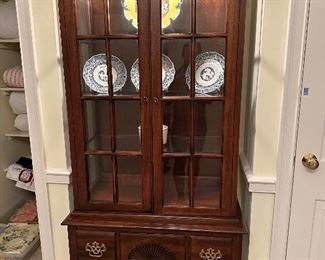 Queen Anne style mahogany display cabinet with lighting