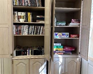 White washed cabinets, tons of dvds and CDs 