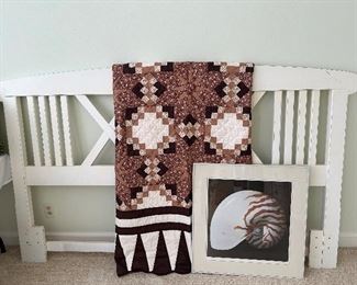 White King sized headboard, quilt, and shell framed decor
