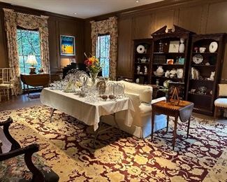 Living room with tons of books and collectibles, gorgeous mahogany book shelves 