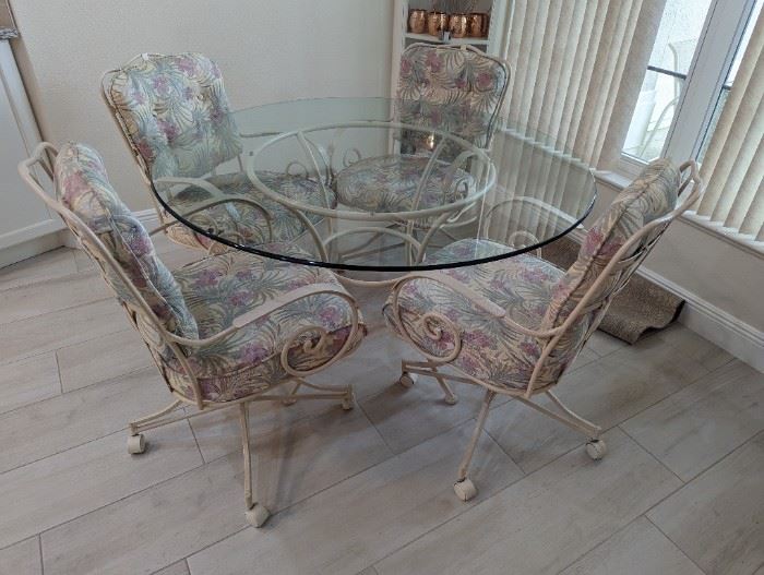 Glass and Metal dinette set w/4 caster chairs