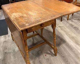 Antique drop leaf table with drawer