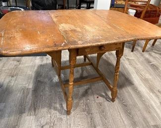 Antique drop leaf table with drawer