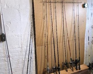 Lots of fishing poles, tackle boxes and lures