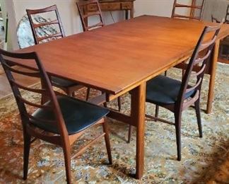 Set of four Niels Koefed (Danish Makers branded mark) side chairs. Mid century modern dining table. 