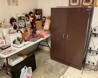 DOLLS AND METAL CABINET