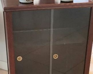 Small curio cabinet with glass doors
