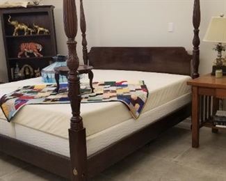 Close up of King-size four-poster bed with Serta mattresses 