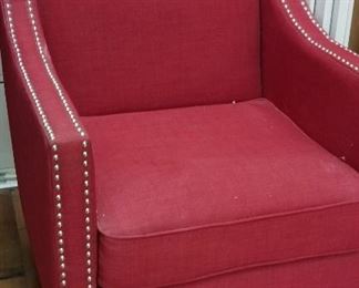 Vibrant red chair with nail trim