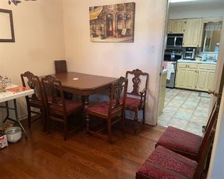 antique solid wood dining table with 2 leaves and 6 chairs