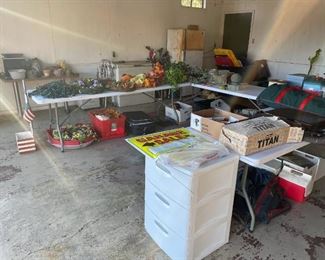 garage full of items - ice chests, hunting supplies, golf clubs and bags, wreaths, suitcases, pots and planting supplies, filing cabinets and much more