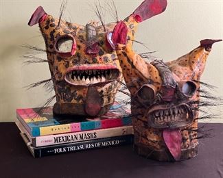 Painted Mexican leather jaguar masks with mirror, animal hair and teeth
