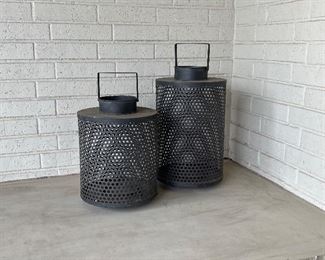 Candles can be placed inside to make these fantastic metal pieces lanterns. Great for  outside.