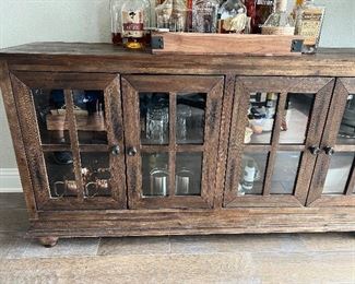 This cabinet is shown as a bar. Could be used for a TV, sweaters, or so much more.