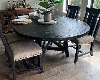 Kitchen, table and chairs. This is shown with the leaf in. It can be taken out for a round table.