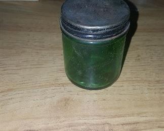 55. VINTAGE GREEN  GLASS JAR  WITH METAL TOP  $5