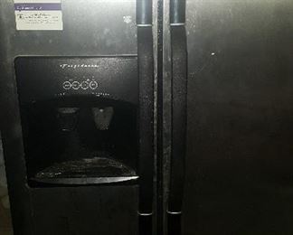 57. STAINLESS STEEL SIDE X SIDE REFRIGERATOR WITH BLACK SIDES $150