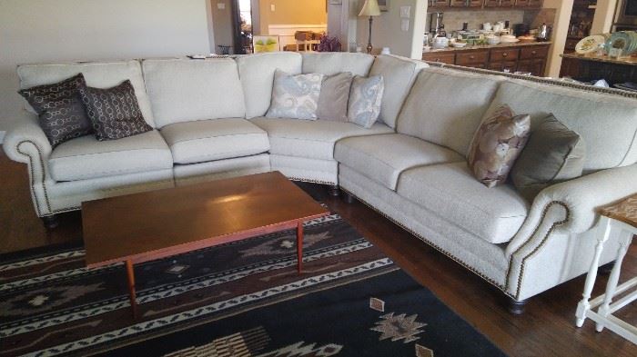 This sofa was custom made from Stacy furniture. It comes in 4 sections so it will be easy for you to carry it out.