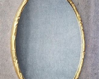 Large Vintage Gilt Painted Wood Trimmed Oval Mirror Carved seashell Detailing with Floral Accent
