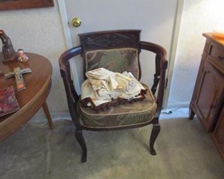 Antique chair with some vintage linens