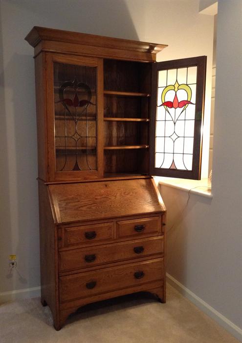 Antique oak secretary with stained glass doors - belonged to owner's family back in Kansas