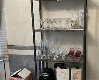 One of the display bookshelves available in the sale, along with stem glassware.
