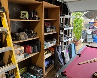 The garage items are fairly well organized on various shelves and tool cabinets.  This is the first picture, showing handheld power tools.