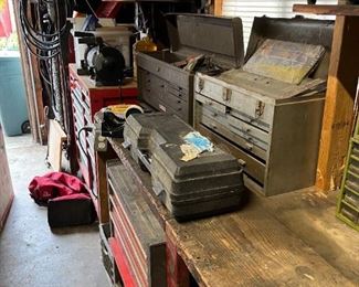 Smaller tool chests are on top of the workbench.