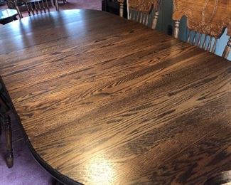 Pristine oak table with six side chairs and two arm chairs
