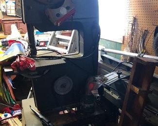 Packed garage with several table top power tools