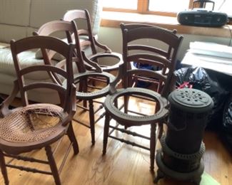 Set of five antique chairs….caning removed.  Small metal stove