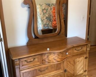 Solid oak double dresser with mirror…presale $125measures 60” long x 21 deep .  Mirror is 46 high