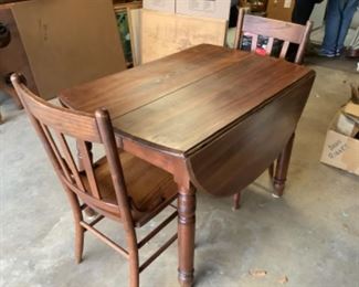 Drop leaf table with two leaves and three chairs…$165 presale