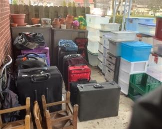 Lots of luggage, totes , clay pots 