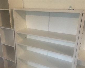 much white shelving/bookcases