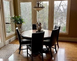 Beautiful breakfast dining table and  leather chairs. 