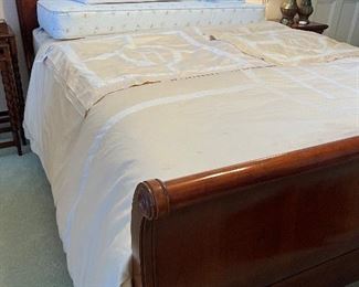 Queen sleigh bed, King sized Matouk bedding with initial “H”, crib mattress