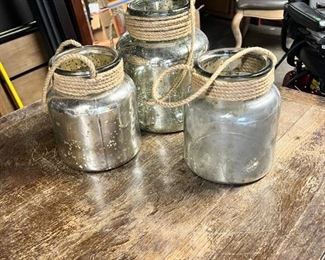 $15 USD      Set of Three Antique Mirrord Jars w/ Rope Handles JC155-12      Description: 3 antique mirrored jars with rope handles. Beautiful when lit with interior candles.
Dimensions: 8.5 x 11H, 2@7.5 x 8H
Condition: Used with minor signs of wear associated with use and age.  Please refer to pictures for more detail.
Location: Local pick up SW Portland, OR. Location is easy access in warehouse. Contact us for shipper suggestions.       https://goodbyhello.com/products/jc155-11?_pos=9&_sid=44ad0c740&_ss=r