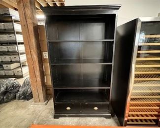 $170 USD      Large 3 Adjustable Shelf Black Bookcase w 2 Lower Drawers JC155-26     Description: Simplicity and storage define the sophisticated look of this double bookcase. Perfect for a study or den, its tall silhouette is statuesque and dramatic. Raised Panel finishing in black offers a versatile palette. Store and display books and decor accents on four tiers of shelving and two drawers.  Fill wall space while creating essential room for treasured volumes. Shelves are adjustable.
Dimensions:  44 x 17 x 79"H
Condition: Used with minor physical signs of wear associated with use and age.  Please refer to pictures for more detail.
Location: Local pick up SW Portland, OR. Location is easy access in warehouse. Contact us for shipper suggestions.      https://goodbyhello.com/products/copy-of-vertical-3-shelf-glass-front-single-door-storage-cabinet-jc155-25?_pos=14&_sid=44ad0c740&_ss=r