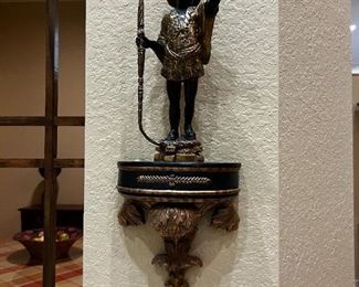 metal statue and stand