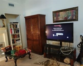 Big screen tv. Stand. Coffee table set.