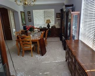 Dining room table with six chairs and can extend an extra foot and a half. Buffet to curio cabinets and a china cabinet