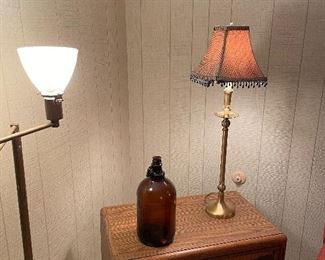 Swing arm Brass lamp with milk glass shade, buffet lamp; and media console cabinet with glass doors