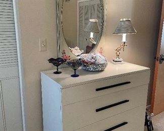 MCM 4-drawer dresser, carnival glass pedestal dishes, swing arm lamp, mirror, and vintage handkerchiefs