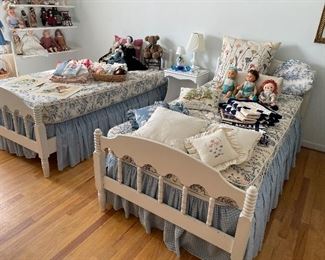 Twin beds (can be converted into bunk beds); nightstand; vintage dolls; and linens