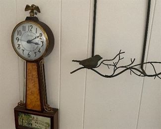 Wall clock and metal artwork