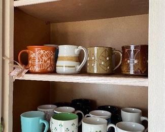 Assortment of coffee mugs: glass, ceramic, and pottery