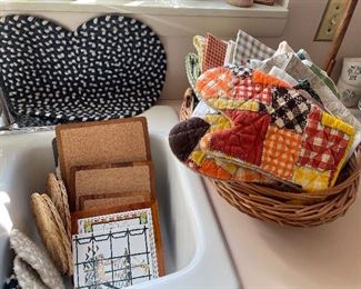 kitchen towels, trivets, and oven mitts